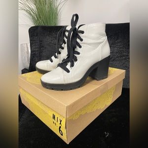 White faux patent leather lace up heeled combat boot